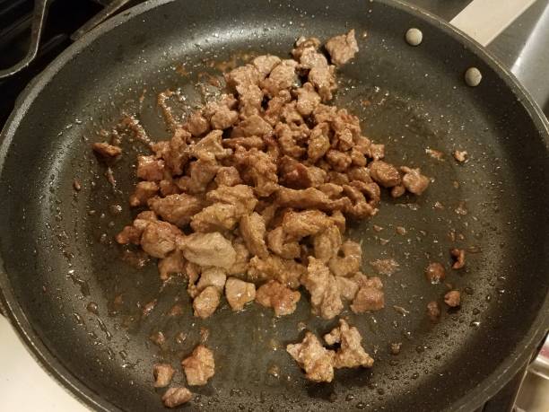 istock ground steak cooking in hot frying pan 1186439516