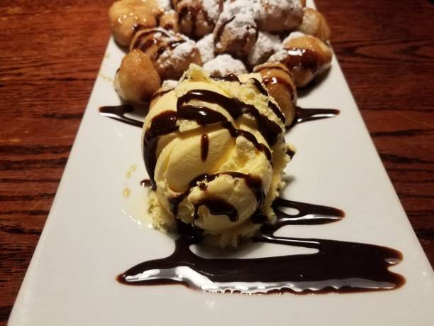 istock fried dough and chocolate sauce and ice cream 1186439528