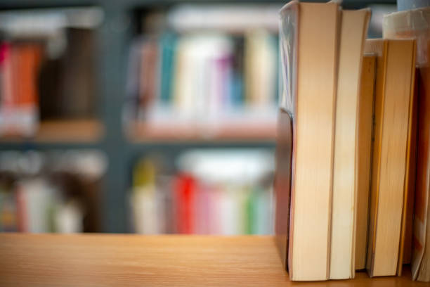 istock books on a shelf in a public library ready to rent and to study 1186445212