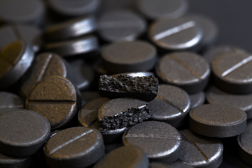 activated carbon in pill form, used in medicine to treat diseases, close-up of medicines