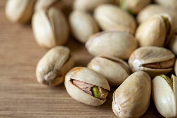 istock Close-up Pistachio nut on wood background 1186452907