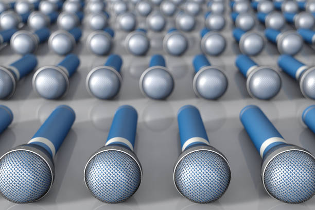 istock many blue microphones arranged in a row 1186454699