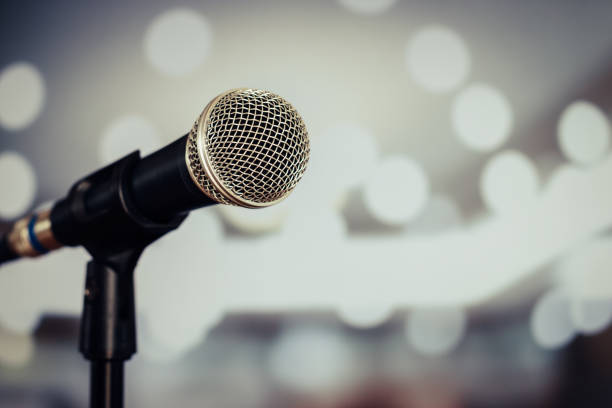 istock Microphones for speech or speaking in seminar Conference room, talking for lecture to audience university, Event light convention hall Background. Business Talk Presentation concept 1186455572