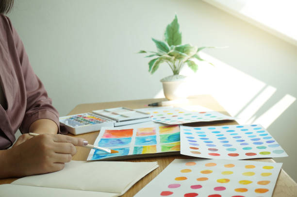 istock Watercolor paints and brushes workplace artist with artistic tools for mock up.Creative Design Concept. 1186456304
