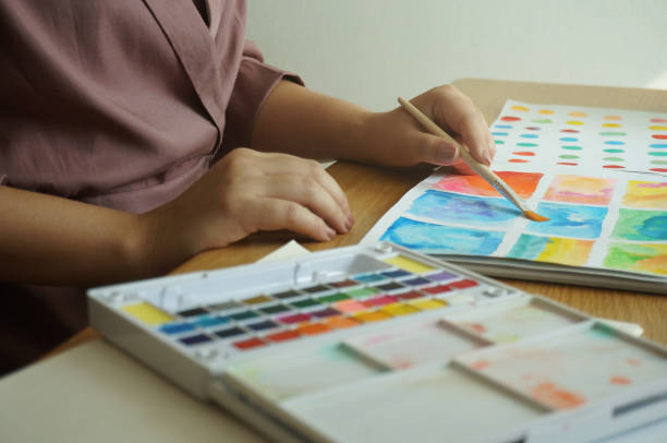 istock Watercolor paints and brushes workplace artist with artistic tools for mock up.Creative Design Concept. 1186456305