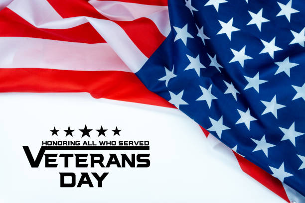 istock Happy Veterans Day with American flags on white background. 1186462391