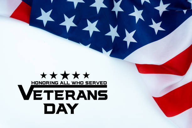 istock Happy Veterans Day with American flags on white background. 1186462448