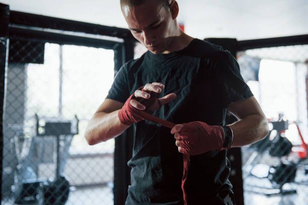 istock Preparation before the training. Close up shot of young boxer 1186466052