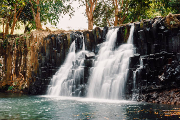 Rochester Falls in Mauritius. Cascade waterfall and beautiful black stones