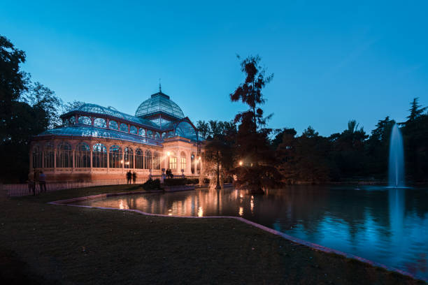 Blue hour view of Crystal Palace or Palacio de cristal in Retiro Park in Madrid, Spain. Blue hour view of Crystal Palace or Palacio de cristal in Retiro Park in Madrid, Spain. The Buen Retiro Park is one of the largest parks of the city of Madrid, Spain palacio de cristal photos stock pictures, royalty-free photos & images
