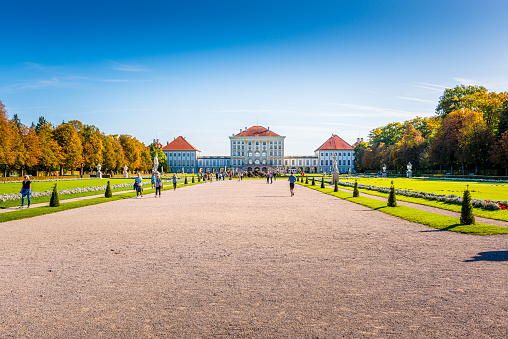 Munich, Germany - October 13, 2019: Nymphenburg castle (Schloss Nymphenburg) is the biggest Baroque palace in Munich. The baroque facades comprise an overall width of about 700 metres. It is one of the most visited sights of Munich.