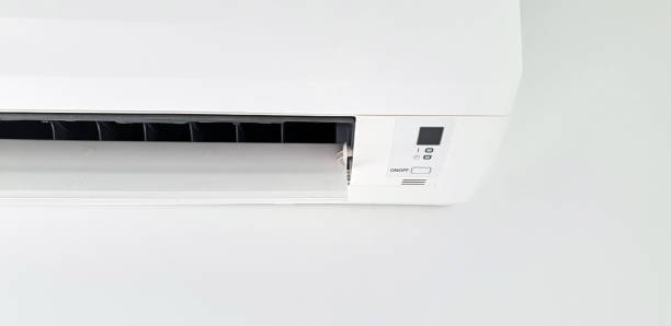 istock Moder air condition unit on a white wall inside the living room. 1186472174