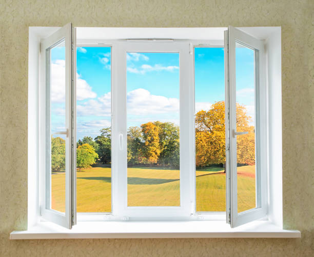 istock View through an opened modern PVC window onto beautiful autumn landscape 1186474536