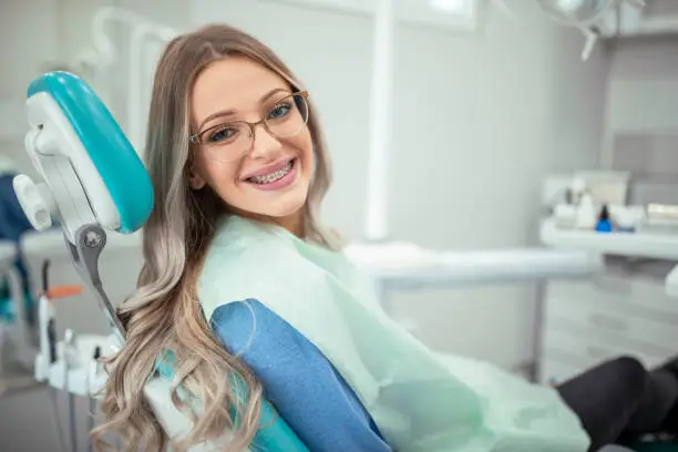 Woman came to see a doctor for exam, sits in a chair