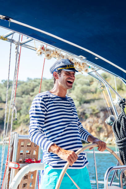 istock Handsome young man on a sailboat 1186478780