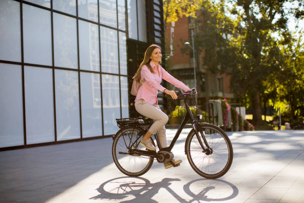 istock Young woman riding an electric bicycle 1186480013