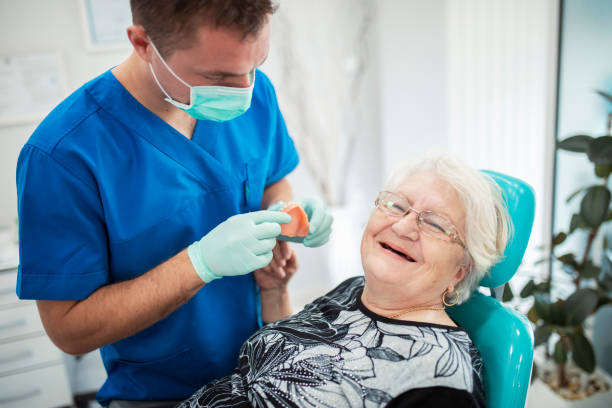 Elderly woman on a review of a dentist, sitting in a chair stock photo