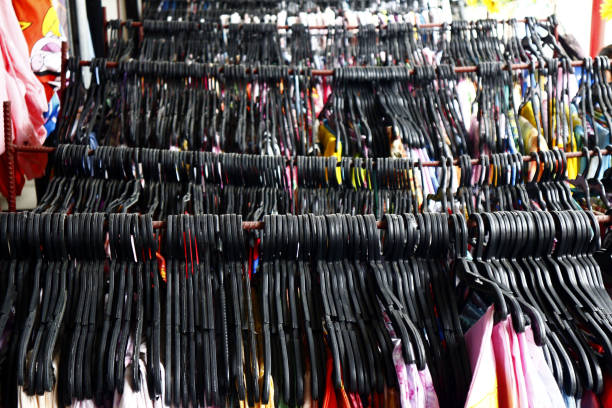 istock Assorted affordable clothes and footwear on display at a bazaar stall 1186489040