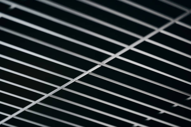 istock Office grille ceiling. Modern black metal grille ceiling, suspended covering. Abstract design texture. 1186495829