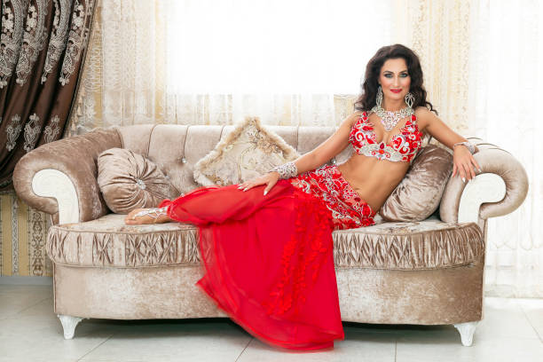 istock Beautiful woman is lying on a luxurious sofa 1186496641