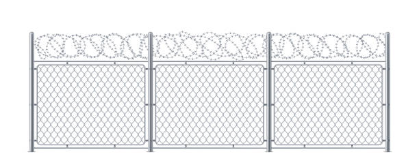 istock Chain link fence with barbed wire. Metal chainlink construction with barbwire or barb, bobbed or bob wire. Steel protection for border security or prison, military or cage. Background or wall, barrier 1186501154