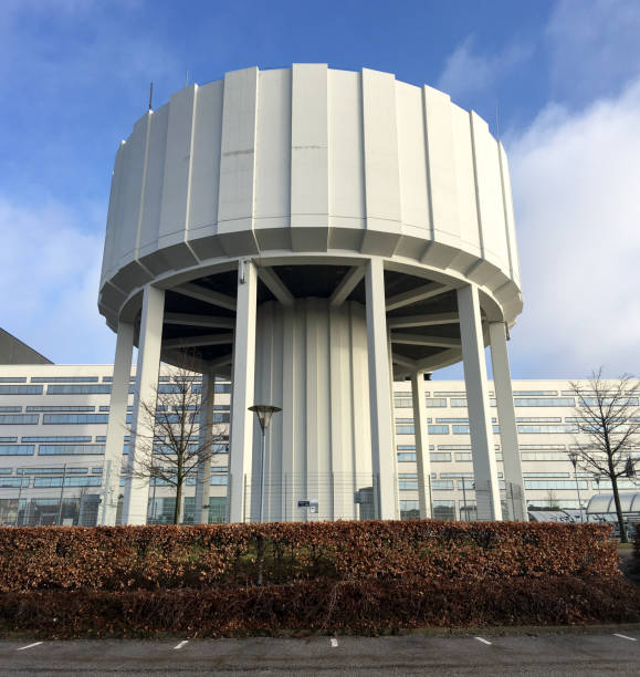 Lund, Sweden - March 21, 2017: The white water tower stands majestically on a hill in northern Lund in between buildings that houses tech companies