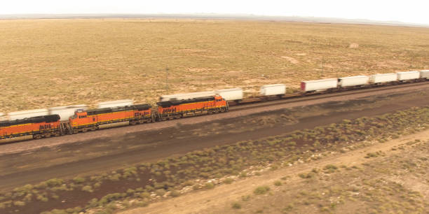 istock AERIAL: Long container freight train transporting goods across the country 1186505796