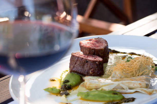 veal medallions medium rare and baked vegetables