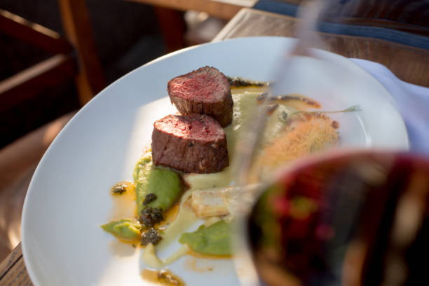 istock beef medallions through a glass of red wine 1186506026