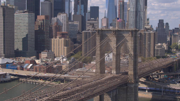 istock AERIAL: Magnificent Brooklyn Bridge against Lower Manhattan downtown cityscape 1186506154