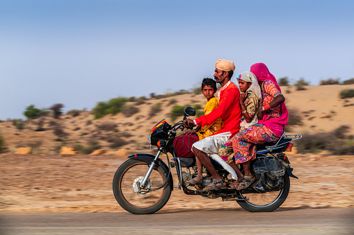 Indian family of 4 on a motorcycle, Rajasthan, India.