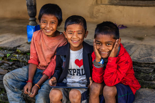 istock Nepali children using digital tablet near Annapurna Range 1186508176