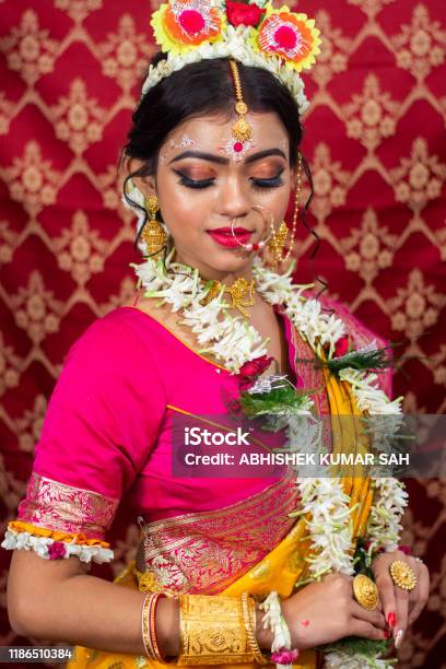 Traditional Bengali Woman In Wedding Sari And Makeup With Flowers And Garland Stock Photo - Download Image Now - iStock Traditional Bengali Woman In Wedding Sari And Makeup With Flowers And Garland Stock Photo - Download Image Now - iStock