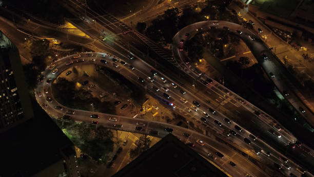 istock AERIAL, CLOSE UP: Heavy traffic on jammed freeway in metropolitan city at sunset 1186512072