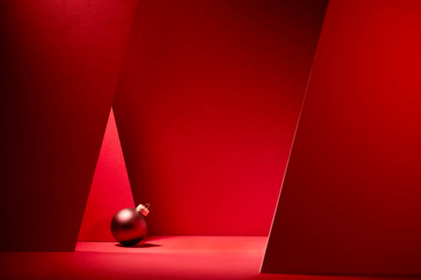 Red Christmas baubles in red background. stock photo