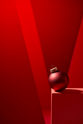 Red Christmas baubles in red background. Suitable for Christmas card.