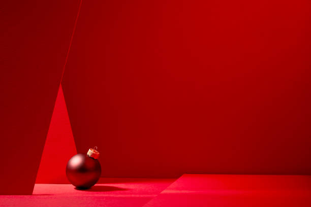 istock Red Christmas baubles in red background. 1186512187