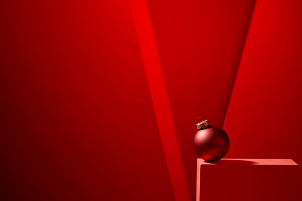 Red Christmas baubles in red background. stock photo