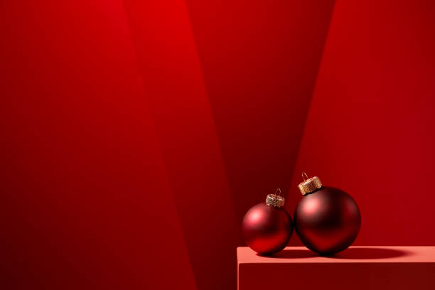 istock Red Christmas baubles in red background. 1186512191