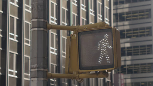 istock CLOSE UP: Pedestrian crossing light turning from walking man sign to red hand 1186512193
