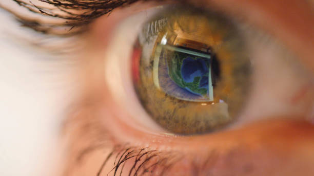 istock MACRO CLOSE UP: Blinking eye looking at world map and zooming image into Mexico. 1186513421