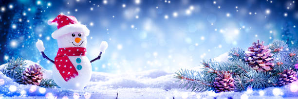 istock Happy Snowman On Snowy Wooden Table 1186513688