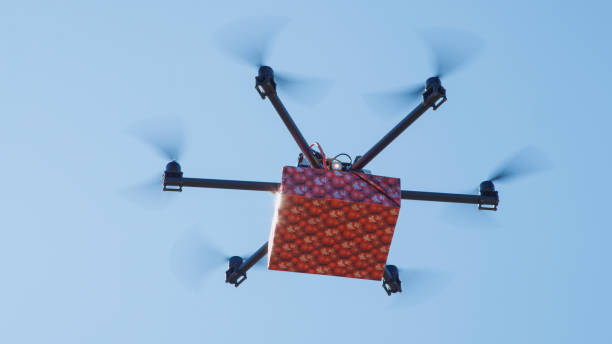 istock CLOSEUP LENS FLARE Last minute gift delivery by cargo multirotor. Drone delivery 1186514170