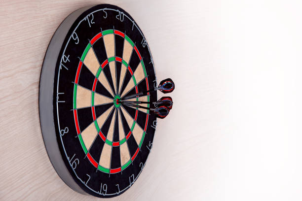 Target dart with arrows on light background, target marketing or successful business concept.