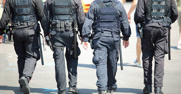 four cops patroling the city stock photo