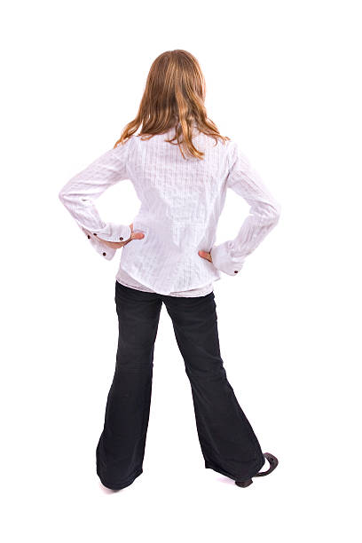 istock little girl facing away from camera on white backdrop 118652264