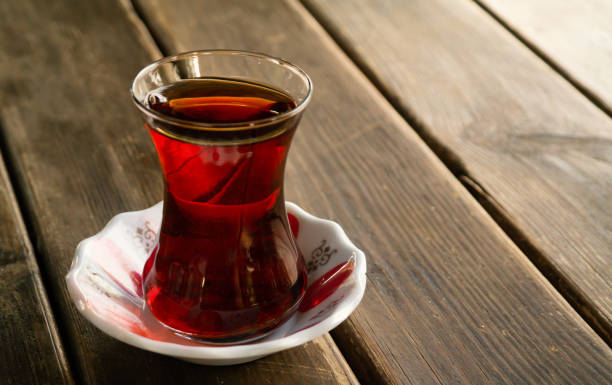 istock turkish black tea in a glass on wooden table 1186524599