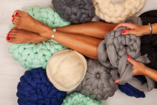 istock Young woman knit chunky merino pouf. 1186524797