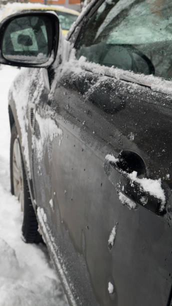istock Defrosting car before driving in the snow. 1186525188