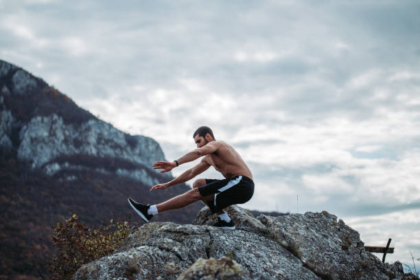 istock Muscular adult man training in forest 1186526457